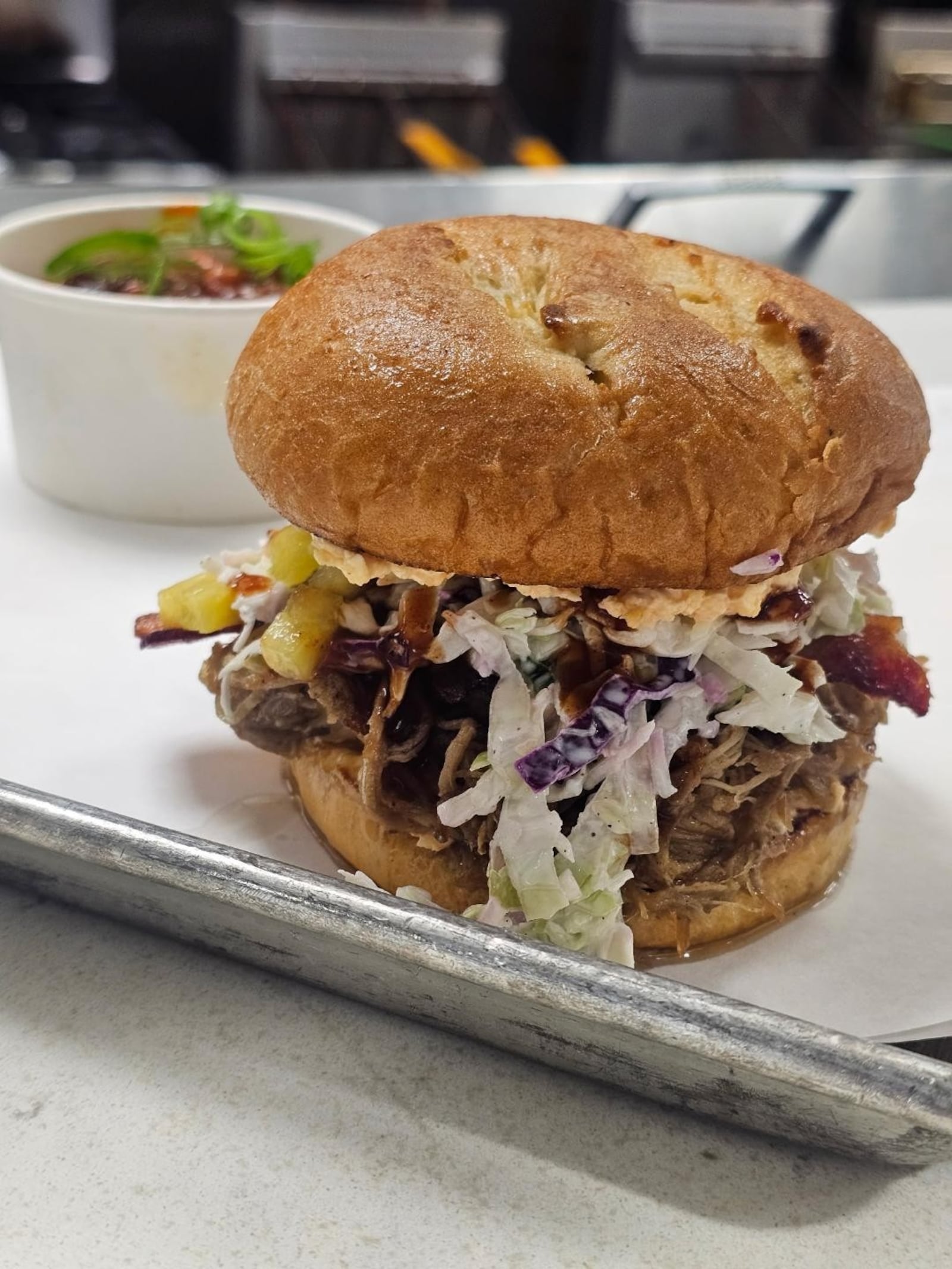 Agave & Rye's Sweet & Spicy Pork Carnitas Sandwich. CONTRIBUTED