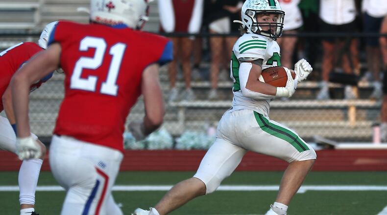Badin's Jack Walsh rushes for a touchdown against Carroll. BILL LACKEY/STAFF