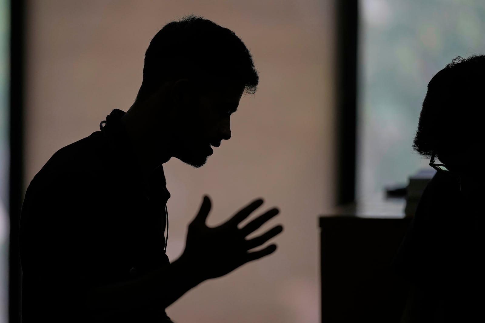 A Rohingya refugee who has not been identified due to safety concerns, talks to The Associated Press in New Delhi, India, about how his family was deported to an island in Myanmar, Friday, May 16, 2025. (AP Photo/Manish Swarup)