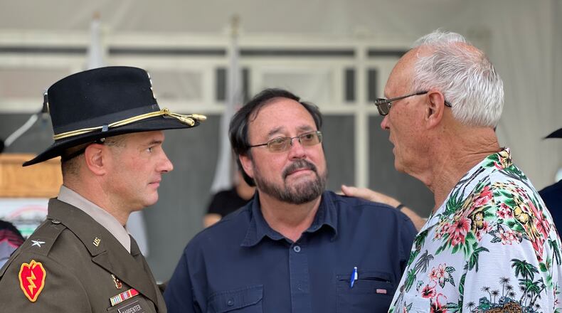 Brig. Gen. Steve Carpenter, deputy commander of the 1st Calvary Division of the U.S. Army, meets with Vietnam veteran Jim Skaggs, right, and Rick McKiddy, brother of the late Sgt. Gary McKiddy. AIMEE HANCOCK/STAFF