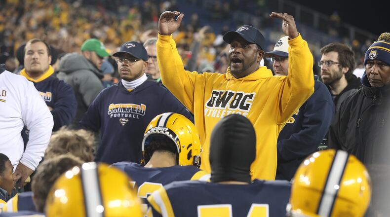 Springfield head coach Maurice Douglass talks to his team after their loss in the state final game Friday. BILL LACKEY/STAFF