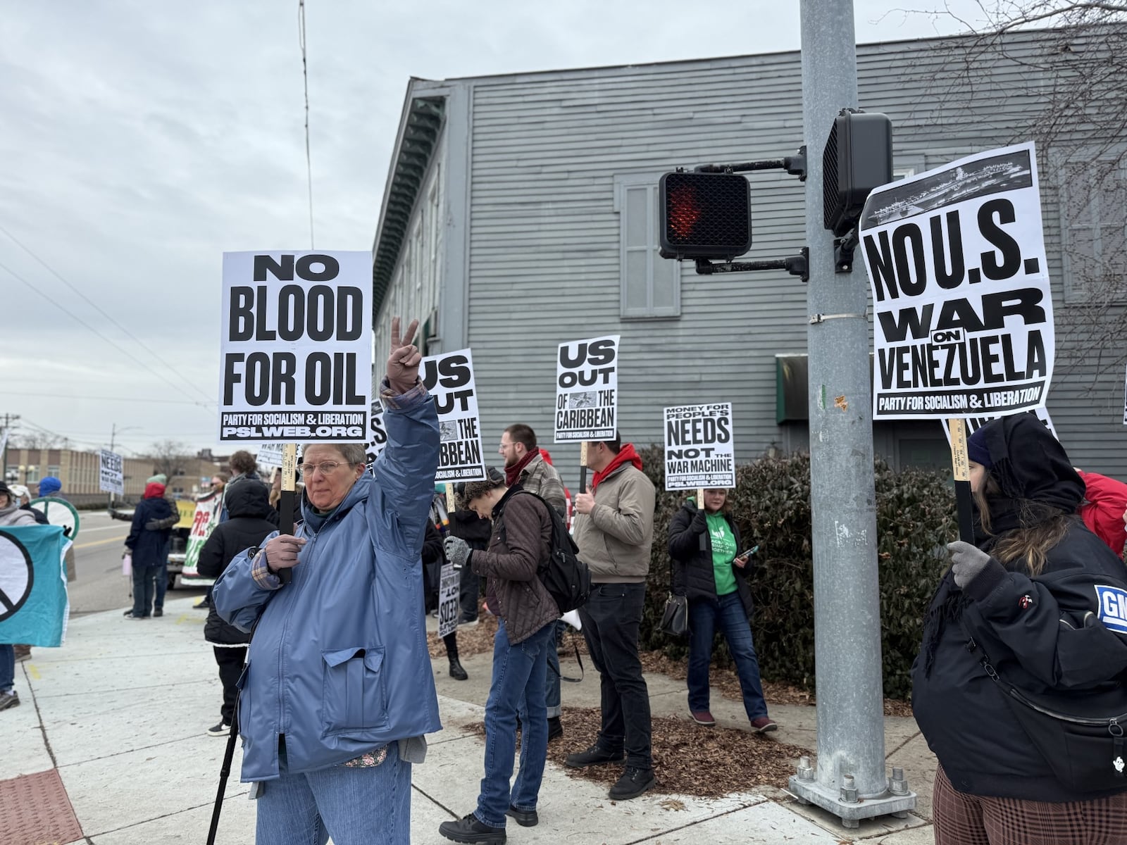 People protest the U.S. invasion of Venezuela on Saturday in the Oregon District in downtown Dayton. Cory Frolik/STAFF