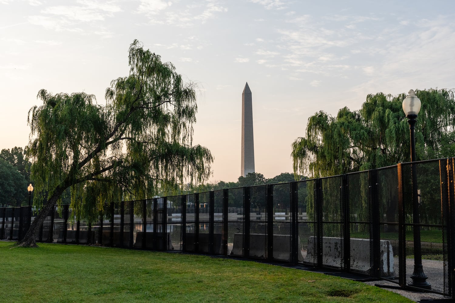 Fencing surrounds Constitution Gardens ahead of the U.S. Army's 250th Anniversary Parade along the National Mall in Washington on Friday, June 13, 2025. (Eric Lee/The New York Times)