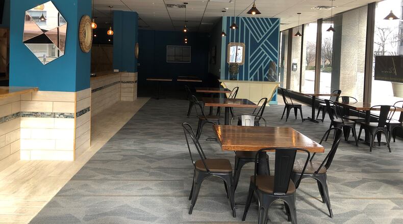 The interior of 1Eleven Flavor House, a "comfort and Caribbean" restaurant. CORNELIUS FROLIK / STAFF