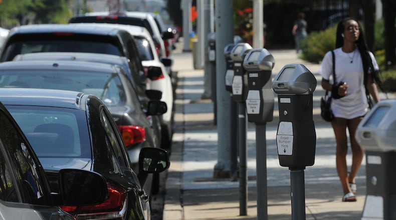 The city of Dayton has launched an app that lets drivers pay for parking on their phone instead of using a meter. MARSHALL GORBY\STAFF
