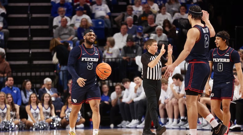 Dayton's Posh Alexander smiles in the final minute of a victory against Saint Louis on Friday, Jan. 31, 2025, at Chaifetz Arena in St. Louis, Mo.. David Jablonski/Staff