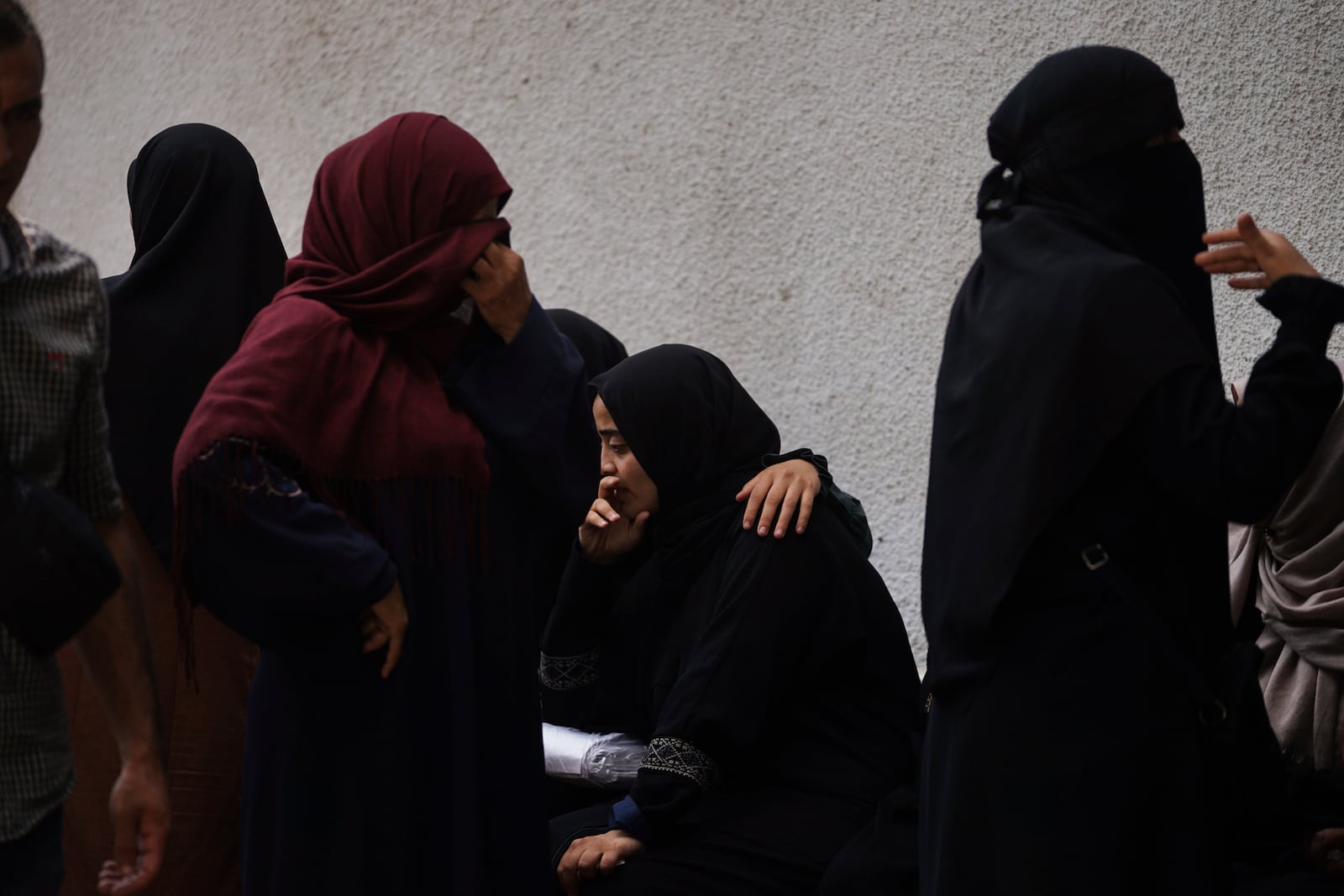Mourners attend the funeral of Palestinians who were killed by an Israeli airstrike, at Shifa Hospital in Gaza City Tuesday, July 15, 2025. (AP Photo/Jehad Alshrafi)