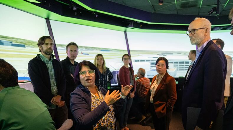 Savvy Verma, left, and Huy Tran, director of aeronautics at NASA’s Ames Research Center in California’s Silicon Valley, center, explain a recent air traffic management simulation to guests at Ames’ FutureFlight Central simulator on Sept. 26.
Credit: NASA/Jesse Carpenter