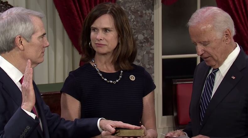 U.S. Sen. Rob Portman, R-Ohio, is sworn in by Vice President Joe Biden. Portman’s wife, Jane is holding the Bible.