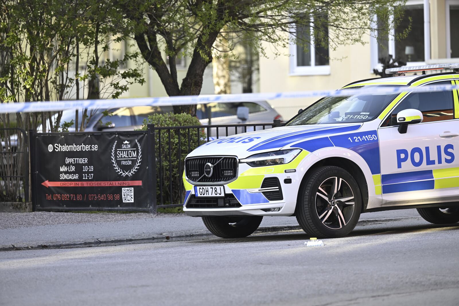 A police vehicle at the scene after a shooting incident, at Vaksala Square, in central Uppsala, Sweden, Tuesday, April 29, 2025. (Fredrik Sandberg/TT News Agency via AP)