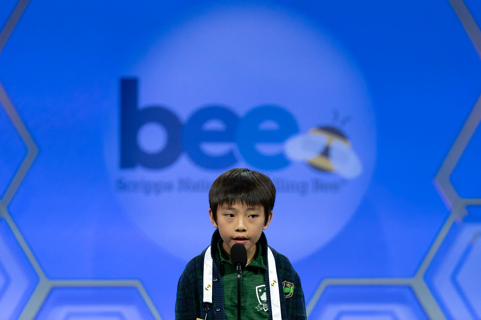 Zachary Ji-Hsien Teoh, 8, of Houston, spells his word as he competes during the quarterfinals of the Scripps National Spelling Bee at the Gaylord National Resort & Convention Center, Wednesday, May 28, 2025, in Oxon Hill, Md. (AP Photo/Jose Luis Magana)