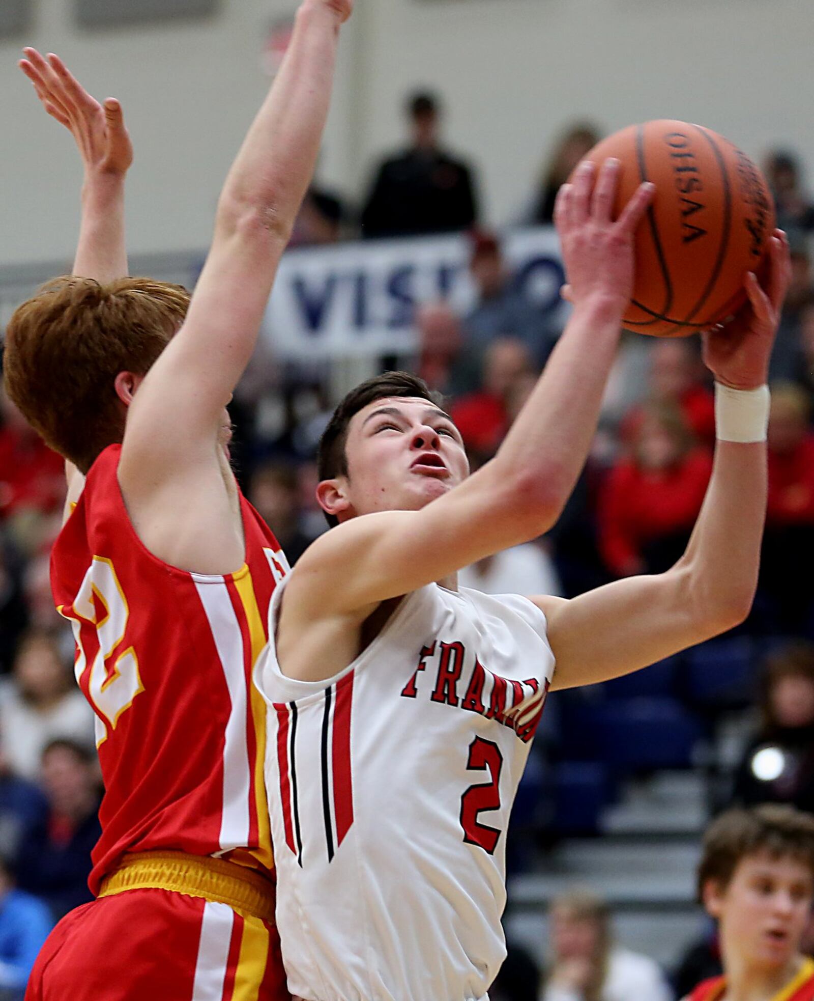Fenwick guard C.J. Hurley covers Franklin guard Payton Knott on Saturday during Division II sectional play at Fairmont’s Trent Arena. CONTRIBUTED PHOTO BY E.L. HUBBARD