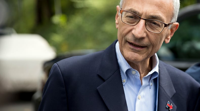 Hillary Clinton campaign chairman John Podesta speaks to members of the media outside Clinton’s home in Washington. The WikiLeaks organization on Oct. 7, posted what it said were thousands of emails from Podesta, including some with excerpts from speeches she gave to Wall Street executives and others — speeches she has declined to release despite demands from Trump. (AP Photo/Andrew Harnik)