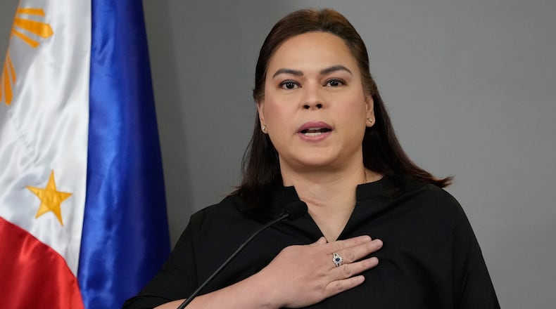 Philippine Vice President Sara Duterte gestures as she announces her intention to run for president in the next elections during a press conference on Wednesday, Feb. 18, 2026, in Manila, Philippines. (AP Photo/Aaron Favila)