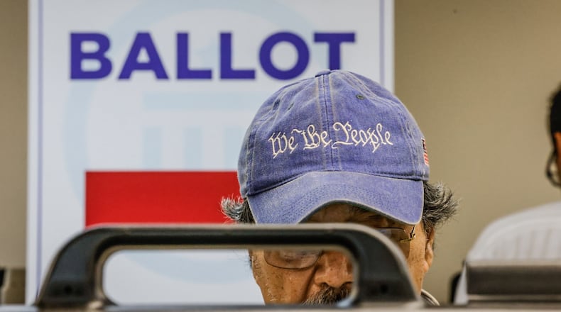 Dr. Juan Gotos from Centerville votes early at the Montgomery County Board of Elections Tuesday October 8, 2024. Jim Noelker/Staff