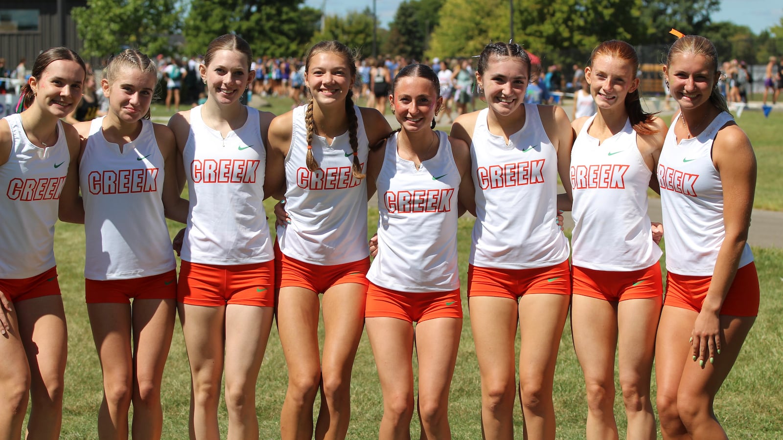 The Beavercreek girls cross country team stands together during a recent meet. HOWARD RUSS