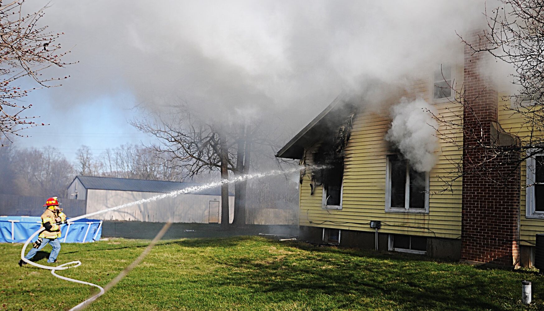 PHOTOS: Crews fight fire in on National Road in New Carlisle