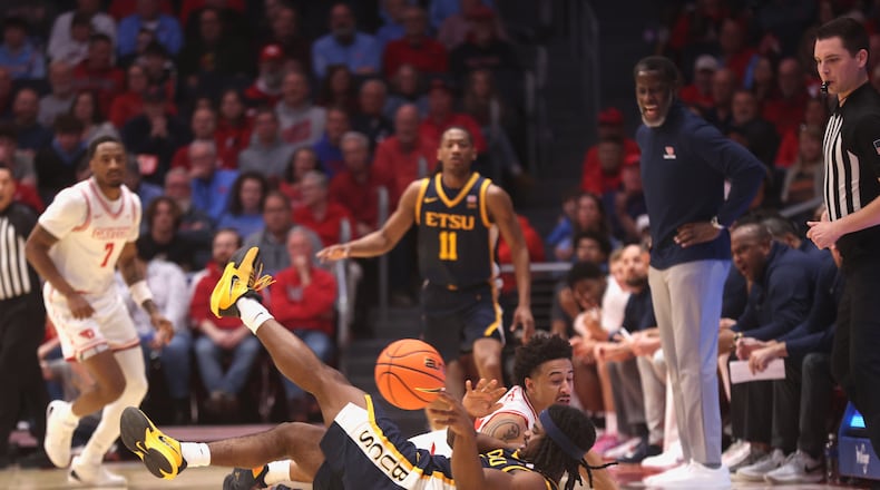 Dayton's Javon Bennett dives for a loose ball against East Tennessee State on Tuesday, Dec. 2, 2025, at UD Arena. David Jablonski/Staff
