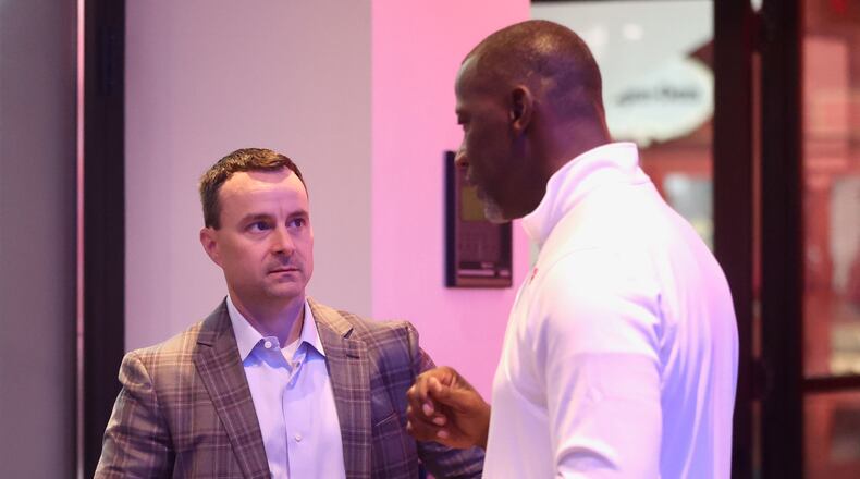 Rhode Island's Archie Miller talks to Dayton's Anthony Grant during Atlantic 10 Conference Media Day on Monday, Oct. 7, 2024, at District E next to Capital One Arena in Washington, D.C. David Jablonski/Staff