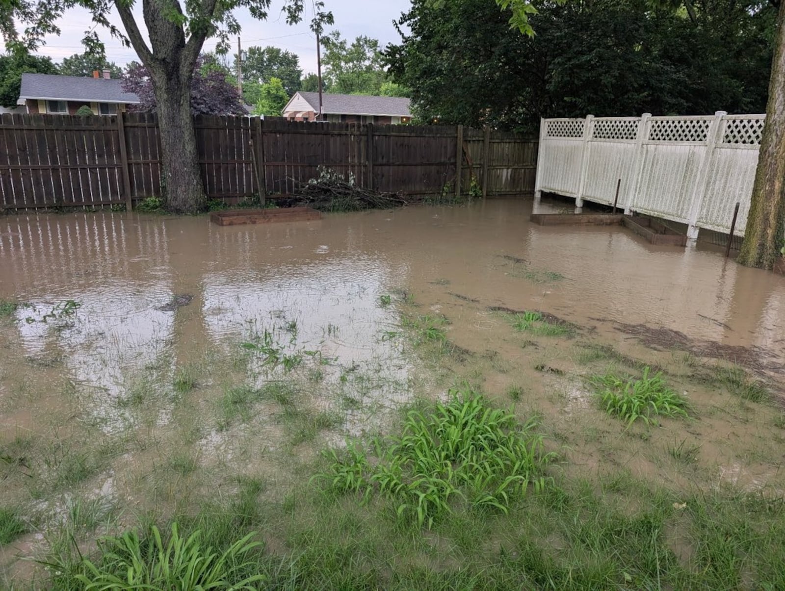 Flooding on Tulip Drive and E. Gibbons Road in West Carrollton Thursday, June 26, 2025. SHARYN BOYLE / STAFF