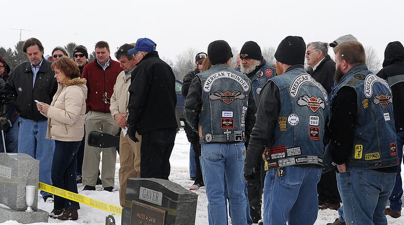 Dorothy Brown, left, the oldest daughter of Billy Standley speaks during her father's funeral at Fairview Cemetery in Mutual Friday. MARSHALL GORBY/ STAFF