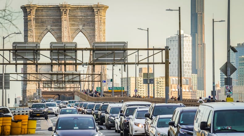 FILE - Traffic enters lower Manhattan after crossing the Brooklyn Bridge, Feb. 8, 2024, in New York. (AP Photo/Bebeto Matthews, File)