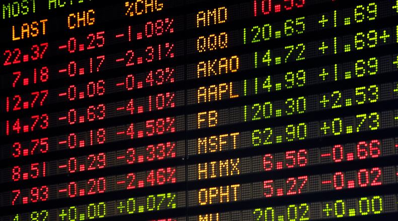 Every area college’s endowment investments inceased over the last year. This lighted stock board is part of the Soin Trading Center inside Rike Hall at Wright State University. TY GREENLEES / STAFF