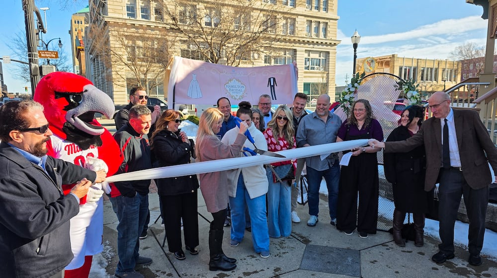 The Hamilton Bridal District held a veil cutting for their official launch Wednesday, Feb. 11, 2026. The district brings together Hamilton-area wedding-related businesses, including venues, hotels, service providers and planners, under a unified local organization. NICK GRAHAM/STAFF