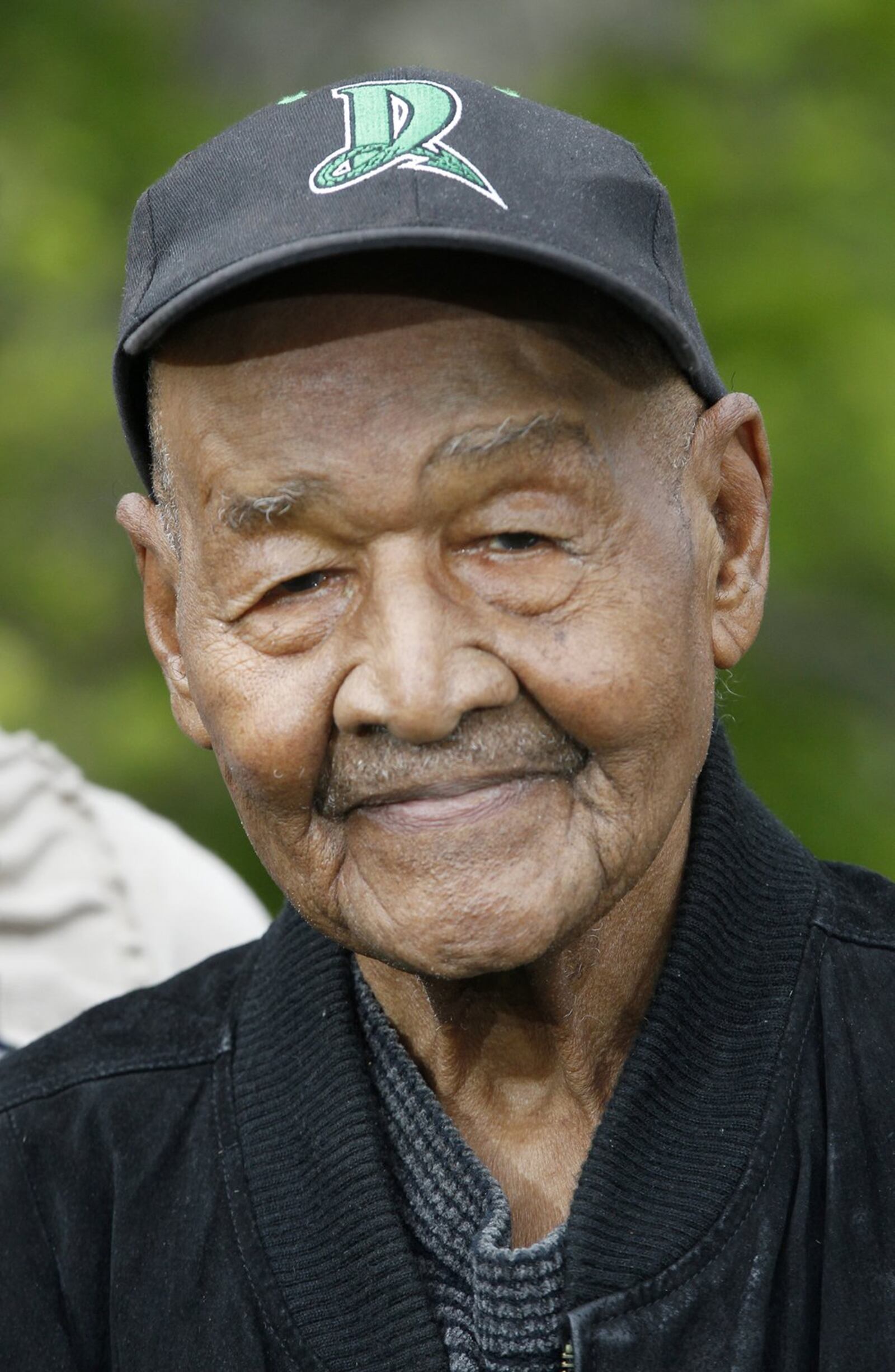 Nathaniel Lee Scott of Dayton celebrated his 100th birthday in March. Scott, who served in the Army and retired after 40 years with General Motors, is an avid baseball fan and will throw out the first pitch at an upcoming Dayton Dragons game. LISA POWELL / STAFF