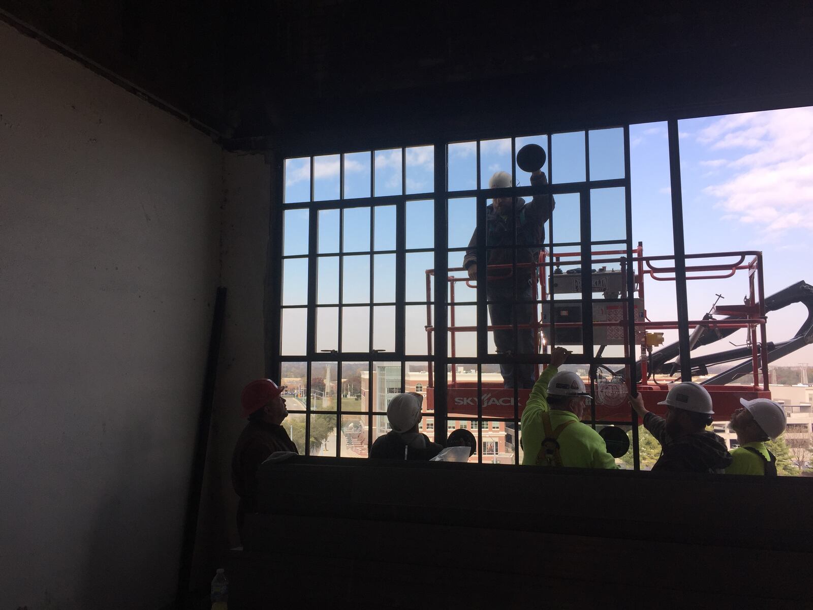 Crews install windows at the Delco Lofts apartments.