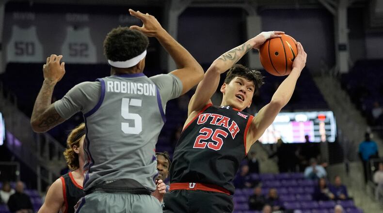 Utah guard Mike Sharavjamts (25) grabs a rebound against TCU forward Micah Robinson (5) during the first half of an NCAA college basketball game Wednesday, Jan. 15, 2025, in Fort Worth, Texas. (AP Photo/LM Otero)