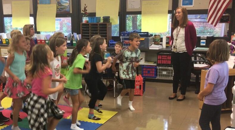 Beavercreek teacher Jessica Renner uses a game to keep Fairbrook Elementary students engaged in the day’s classroom lessons. JEREMY P. KELLEY / STAFF