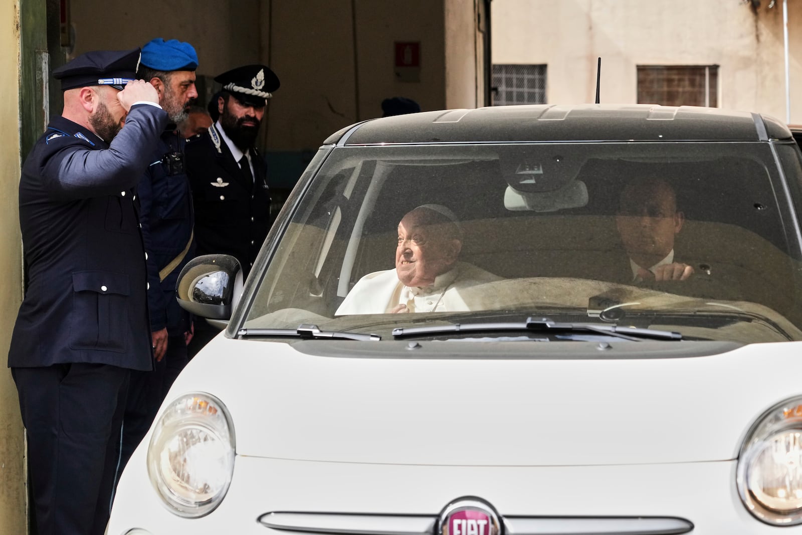 Pope Francis leaves in a car at the end of his visit to the Regina Coeli penitentiary in Rome on Holy Thursday, Thursday, April 17, 2025. (AP Photo/Andrew Medichini)