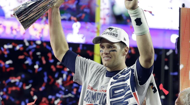 Quarterback Tom Brady celebrates with his fourth Vince Lombardi Trophy after the Patriots defeated the Seahawks 28-24 in the NFL Super Bowl XLIX football in Glendale, Arizona. Being lucky enough to avoid being picked by the Browns truly has been a blessing for the University of Michigan product. AP photo