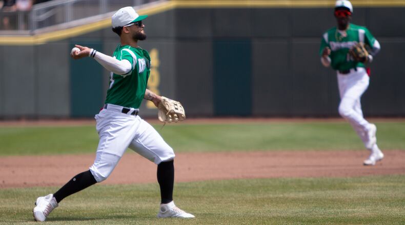 Dragons third baseman J.V. Martinez throws out a runner on a ground ball during the second inning of Sunday's game against West Michigan at DayAir Ballpark. Jeff Gilbert/CONTRIBUTED