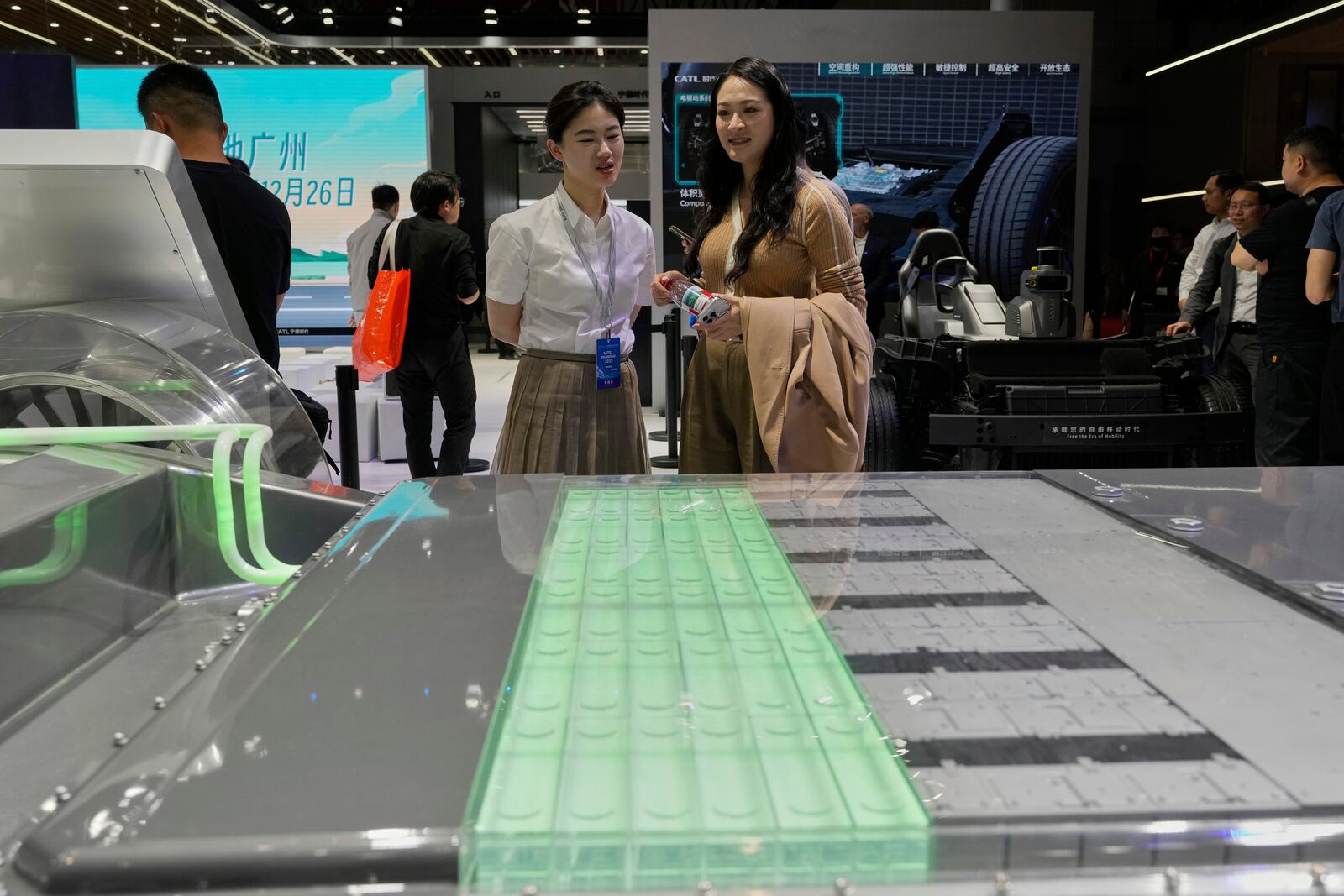 Visitors look at the fast charging battery from CATL that promises 520km from 5 minutes of charging at the Shanghai auto show on Wednesday, April 23, 2025. (AP Photo/Ng Han Guan)
