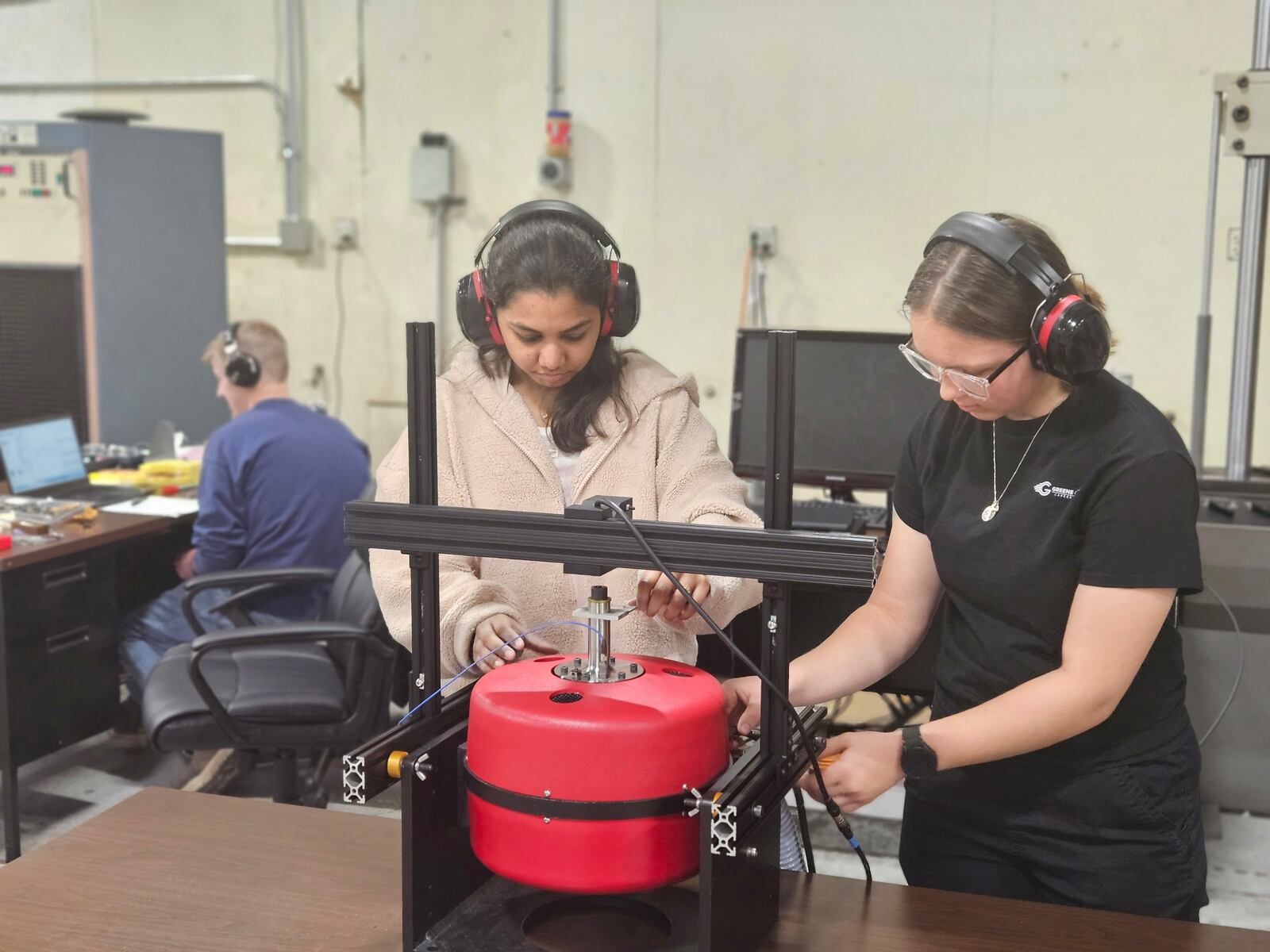 Hyphen Innovations employees demonstrate scanners and software. The Dayton-area defense firm is preparing for a major facility upgrade with renovations underway at its newly remodeled 6,500-square-foot headquarters at 3250 Kettering Blvd. in Moraine. CONTRIBUTED/Hyphen Innovations.