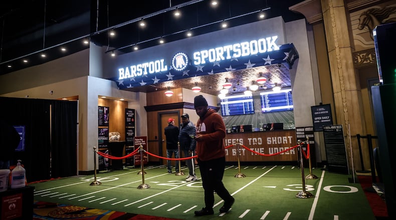 Gamblers, foodies and goodtime seekers walk the aisles at Hollywood Gaming at Dayton Raceway Friday afternoon January 13, 2023. JIM NOELKER/STAFF