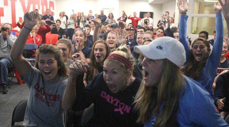 Dayton players celebrate after hearing their name called on the NCAA women’s soccer selection show Monday. David Jablonski/Staff