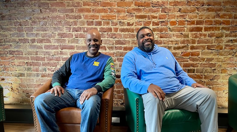 Dallas Webster and Jeff Jackson (left to right), neighbors for 15 years, are investing in their community by opening a cigar shoppe and lounge in Dayton’s Wright Dunbar Business District. NATALIE JONES/STAFF