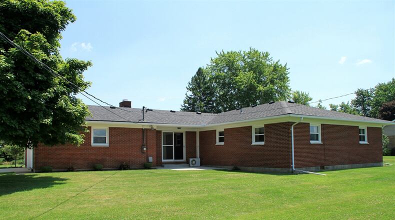 Patio doors off the family room open to a concrete patio that was new about 5 years ago. The patio overlooks the open back yard as the brick ranch sits on just under an acre with no rear-neighbors.