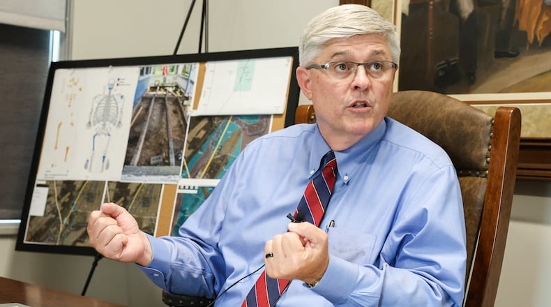 Greene County Coroner Kevin Sharrett speaks during a news conference in his office on Tuesday, Aug. 19, 2025, in Xenia. Sharrett said human bones found in a home renovation north of Xenia in April were more than 100 years old, and the case does not meet criteria for a forensic investigation. BRYANT BILLING / STAFF