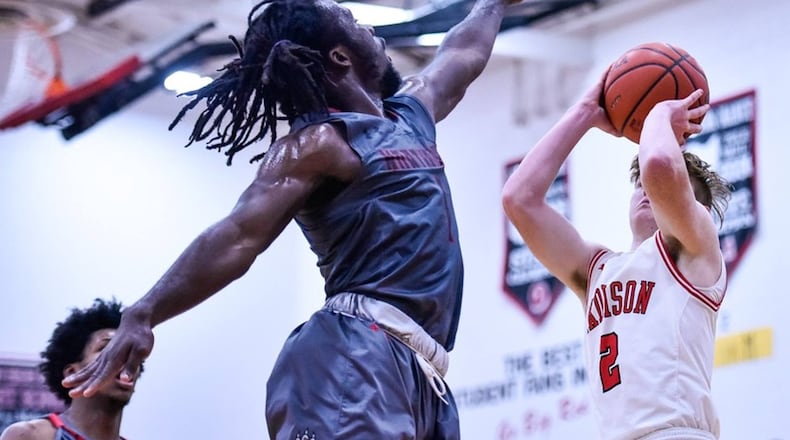 A three-year starter and leading scorer, Northridge senior Twon Hines (center) hit the winning 3-pointer in a 58-56 win at Middletown Madison on Friday, Feb. 8, 2019. NICK GRAHAM / STAFF