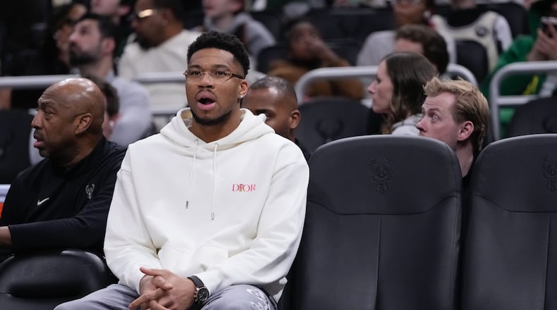 Milwaukee Bucks' Giannis Antetokounmpo sits on the bench during the first half of an NBA basketball game Wednesday, Feb. 4, 2026, in Milwaukee. (AP Photo/Morry Gash)