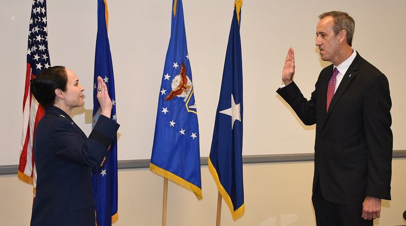 Brig. Gen. Alice W. Trevino, Air Force Installation Contracting Center commander, conducts a Senior Executive Service induction ceremony June 5 for Anthony ‘Tony’ Everidge, as he is named AFICC’s executive director. (U.S. Air Force photo/Thomas Lewis)