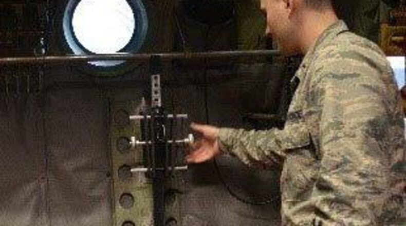 The Air Force Research Laboratory’s Junior Force Warfighter Operations team is working on updating gun racks, or Modular Weapon Storage Systems, for the Air Force’s C-130 aircraft. (Contributed photo)