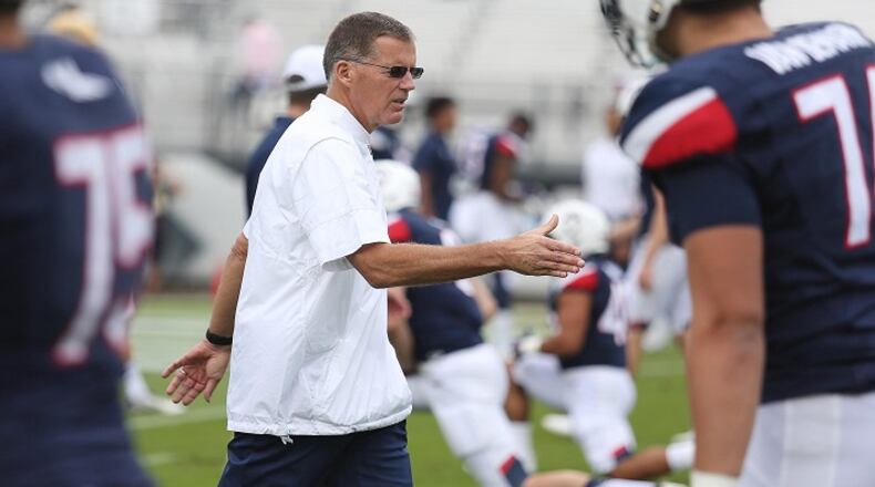 UConn head coach Randy Edsall shakes hands with his players before facing UCF on Saturday, Nov. 11, 2017 at Spectrum Stadium in Orlando, Fla. (Stephen M. Dowell/Orlando Sentinel/TNS)