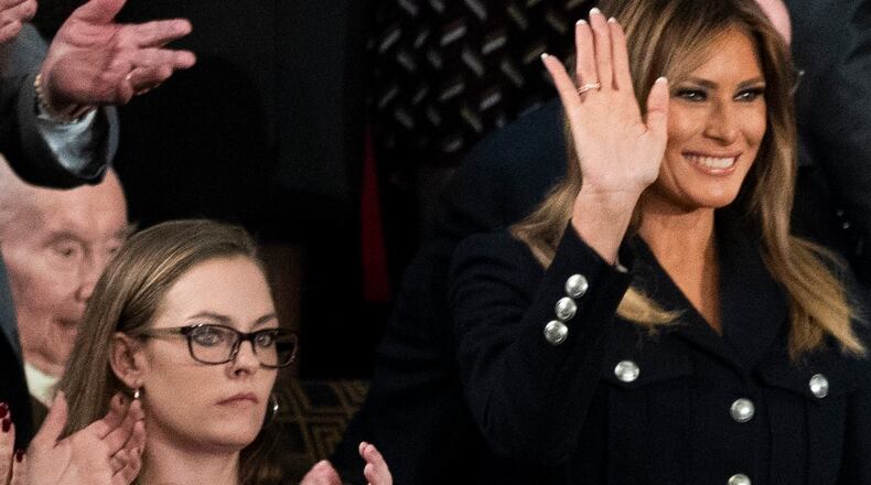 First Lady Melania Trump waves next to Ashley Evans who grew up in Dayton at the State of the Union address, at the Capitol in Washington, Feb. 5, 2019. (Sarah Silbiger/The New York Times)