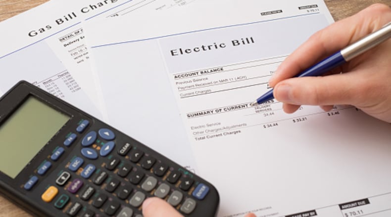 Electric bill charges paper form on the table
