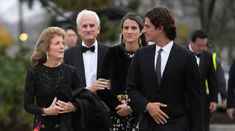 FILE - Caroline Kennedy, ambassador of the United States to Australia, left, arrives with her husband, Edwin Schlossberg, center left, and her children, Tatiana Schlossberg, center right, and Jack Schlossberg, right, Sunday, Oct. 29, 2023, before the presentation ceremony for the John F. Kennedy Profile in Courage Award at the John F. Kennedy Presidential Library and Museum, in Boston. (AP Photo/Steven Senne, File)